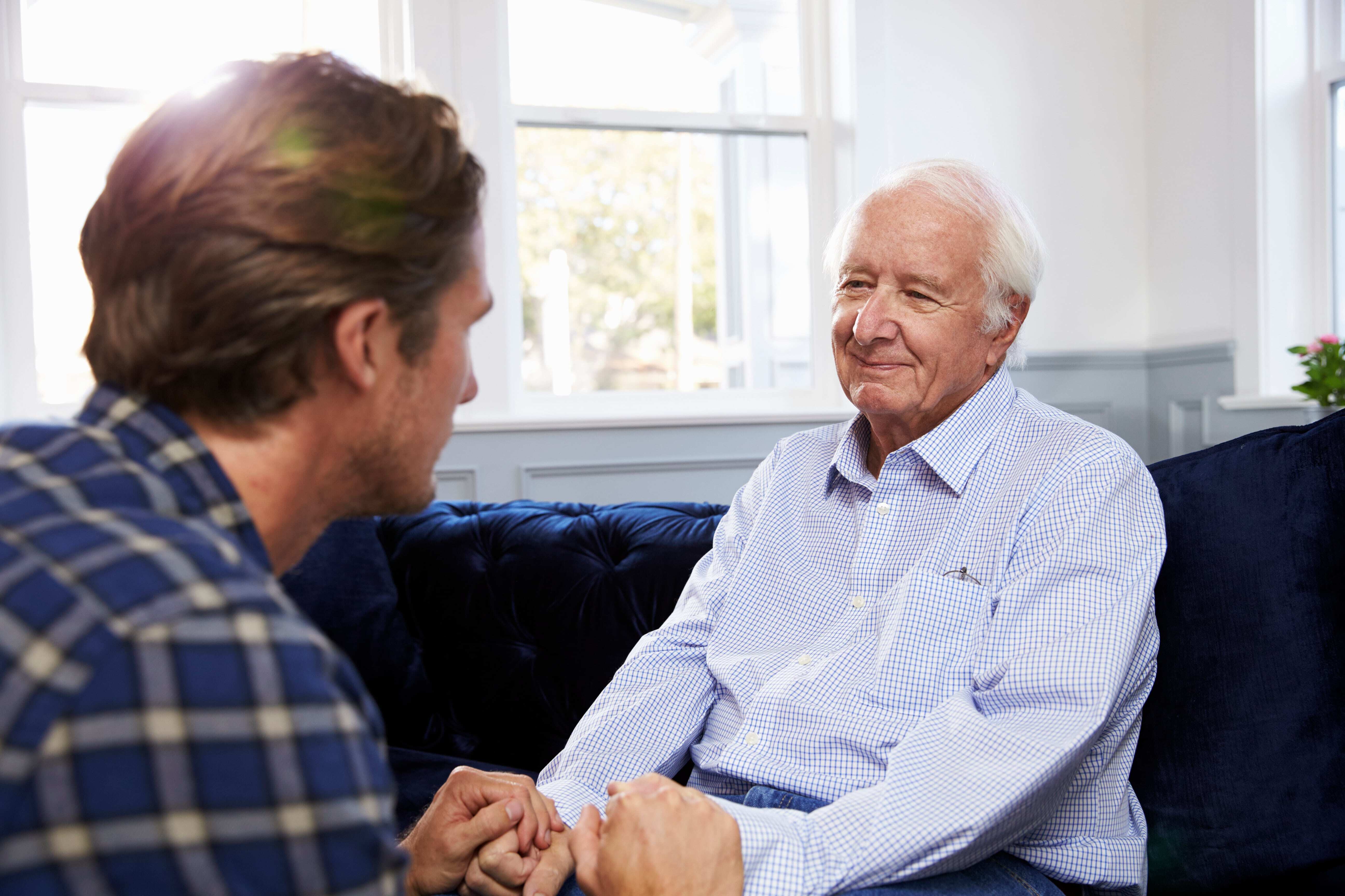 Son talking to his father about Hospice care