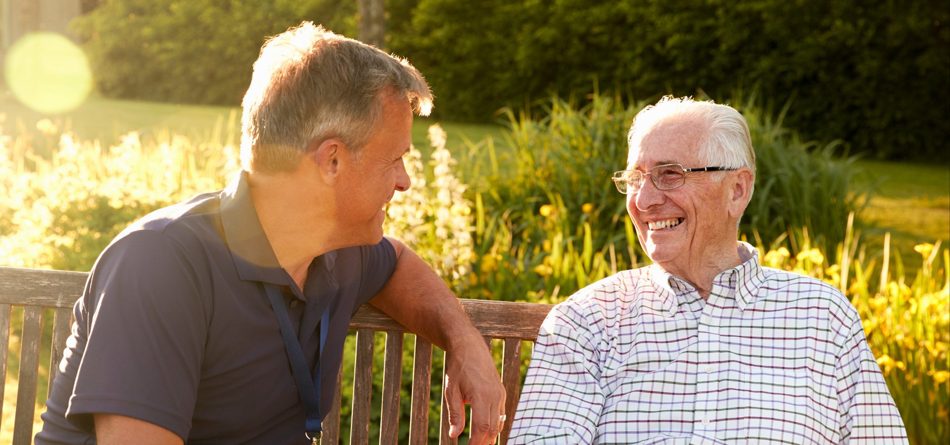 senior couple chatting on a bench