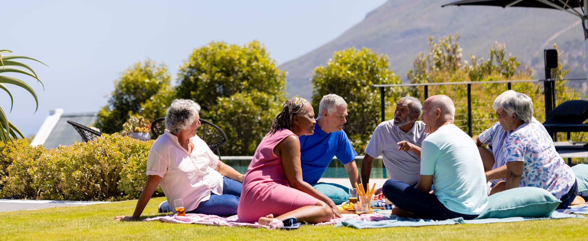 group of seniors having a picnic outside