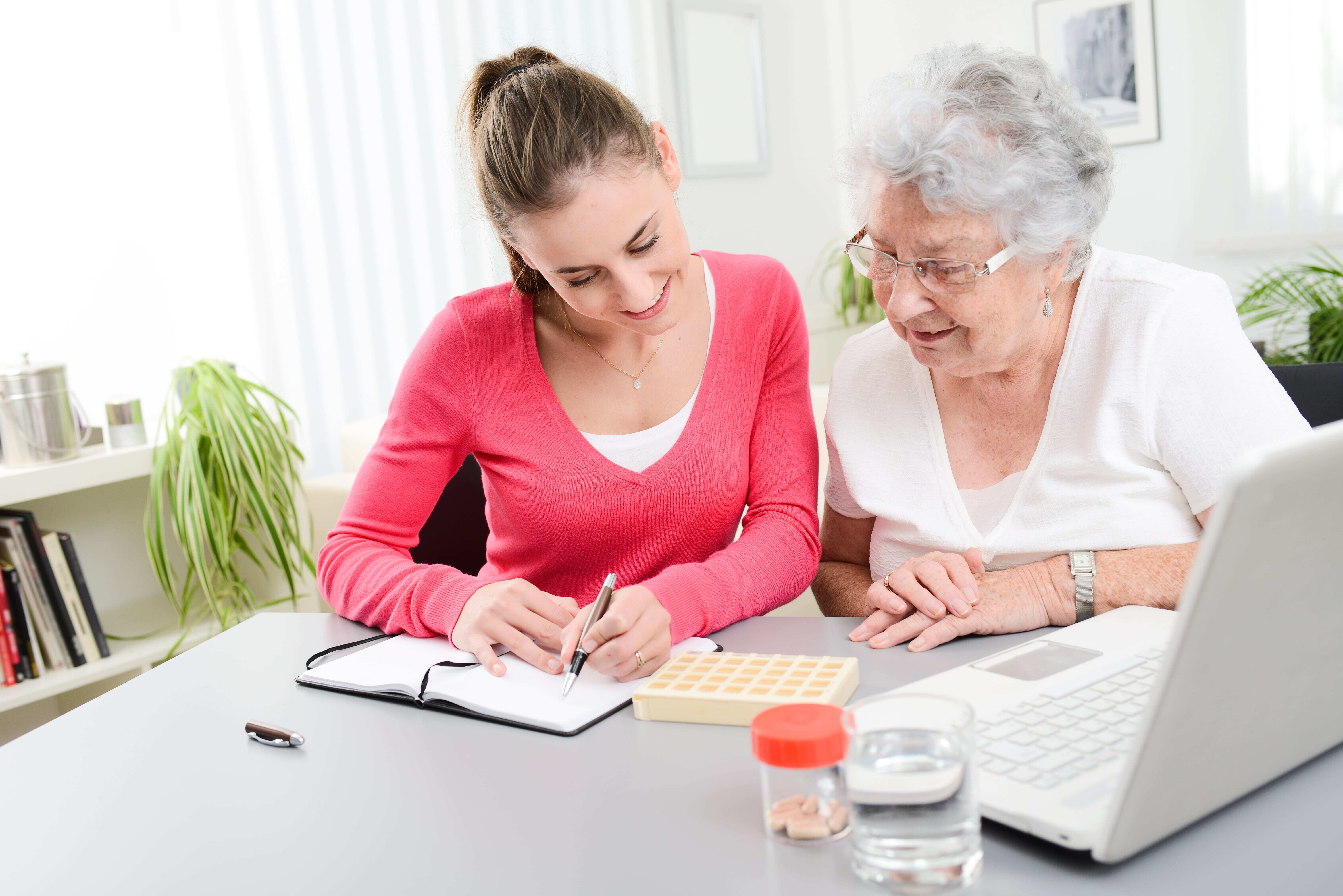 Daughter helping her older mom with medication management