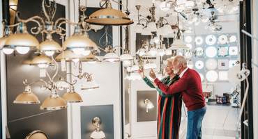 senior couple looking at home decor options