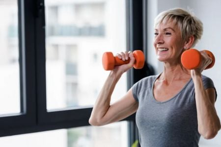 senior woman lifting weights